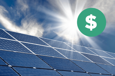 Sun shining on solar panel with dollar sign overlaid in the corner.