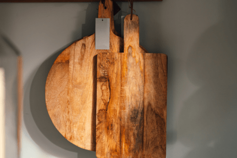 Cutting boards hanging vertically.