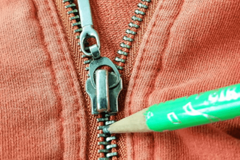 Green pencil on zipper.