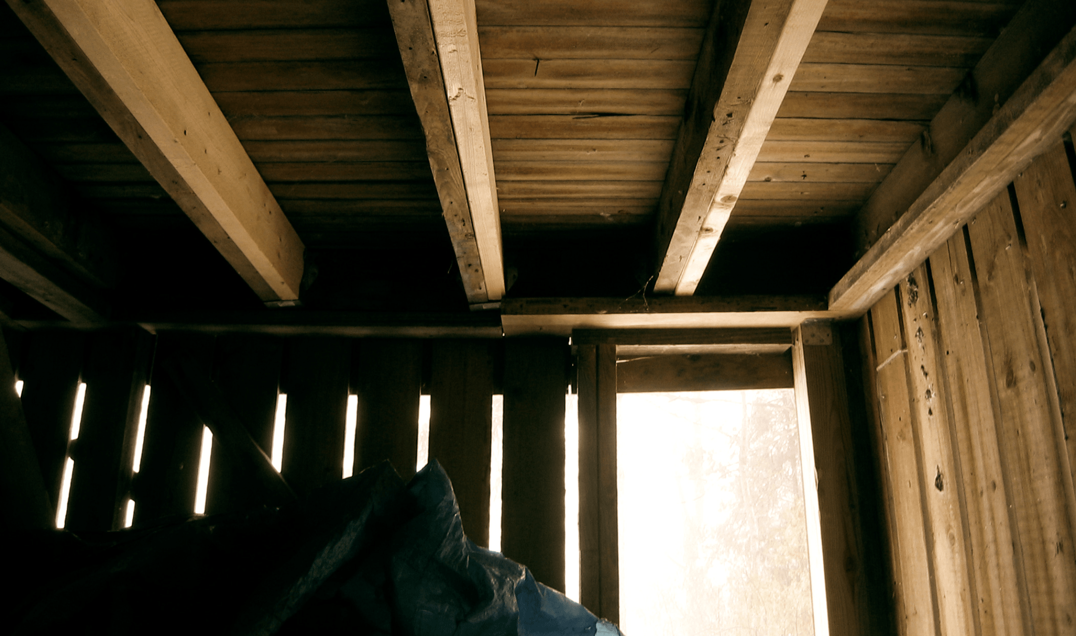 A photo taken from under a high deck.