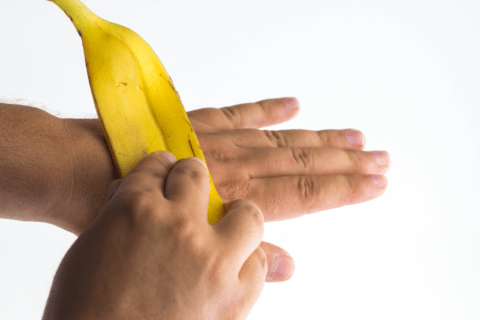 Rubbing banana peel on skin.